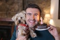 Man celebrating his dog first birthday Royalty Free Stock Photo