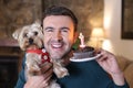 Man celebrating his dogÃÂ´s birthday Royalty Free Stock Photo