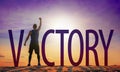 Man celebrating success. Victory text and person as silhouettes against sun in sky Royalty Free Stock Photo