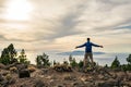 Man celebrating sunset looking at view in mountains Royalty Free Stock Photo
