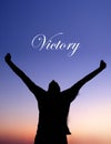 Man Celebrating at Sunset with Victory text Royalty Free Stock Photo