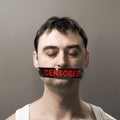 Man with censored tape on face