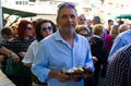 A man with a ceramic cup