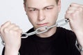 Man in chain shackles on graybackground