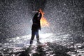 man with chainsaw in the hands on the night snow background