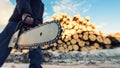 Man with a chainsaw at logging