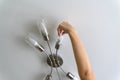 A man changes a burnt out light bulb in a chandelier Royalty Free Stock Photo