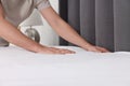 Man changing bed linens at home, closeup Royalty Free Stock Photo