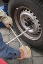 Man changing a car tyre Royalty Free Stock Photo
