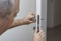 man changing the door lock at home Royalty Free Stock Photo