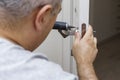 Man changing the door lock at home Royalty Free Stock Photo