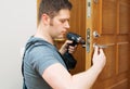 Man changing door lock Royalty Free Stock Photo