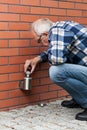 Man changing the light bulb outside Royalty Free Stock Photo