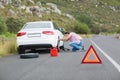 Man changing wheel after a car breakdown Royalty Free Stock Photo