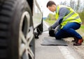 Man changing wheel Royalty Free Stock Photo