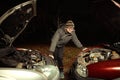 Man charging battery of car by cables and other car Royalty Free Stock Photo