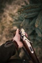 Man is charging his hunting guns. Male hunters is ready for hunting. Detail on rifle and ammunitions.