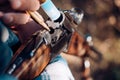 Man is charging a hunting rifle. American hunting rifles. Hunter with shotgun gun on hunt.