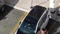 Man charging left-hand drive BMW i3 car