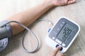 Man check blood pressure monitor and heart rate monitor with digital pressure gauge. Health care and Medical concept Royalty Free Stock Photo