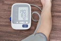 Man check blood pressure monitor and heart rate monitor with digital pressure gauge. Health care and Medical concept Royalty Free Stock Photo