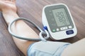 Man check blood pressure monitor and heart rate monitor with digital pressure gauge. Health care and Medical concept Royalty Free Stock Photo