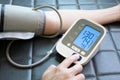 Man check blood pressure monitor and heart rate monitor with digital pressure gauge. Health care and Medical concept Royalty Free Stock Photo