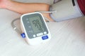 Man check blood pressure monitor and heart rate monitor with digital pressure gauge. Health care and Medical concept Royalty Free Stock Photo