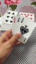 A man check poker cards with three ace card , ace, heart, diamond, clubs, spade Royalty Free Stock Photo