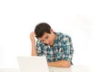 Man in check shirt with laptop Royalty Free Stock Photo