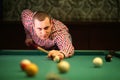 A man in a checkered shirt playing Royalty Free Stock Photo