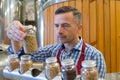 Man checking beer malt in laboratory Royalty Free Stock Photo