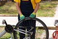 Man checking bicycle tire air pressure Royalty Free Stock Photo