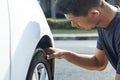 Man checking car tire Royalty Free Stock Photo