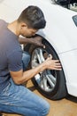 Man checking car tire Royalty Free Stock Photo