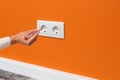 Man is checking the electrical outlet Royalty Free Stock Photo