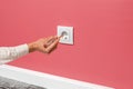 Man is checking the electrical outlet Royalty Free Stock Photo