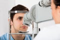 Man Checking Eyesight In Clinic