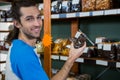 Man checking grocery items in supermarket