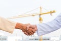 The man checking the hand with commitment to sucess at construction site and crane background