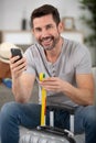 man checking hand luggage measurements Royalty Free Stock Photo