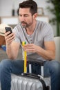 Man checking hand luggage size Royalty Free Stock Photo