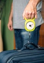 Man checking luggage weight with steelyard balance Royalty Free Stock Photo