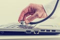 Man checking his laptop with a stethoscope Royalty Free Stock Photo