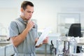 Man checking list on clipboard in warehouse Royalty Free Stock Photo