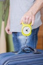 Man checking luggage weight with steelyard balance Royalty Free Stock Photo