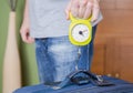 Man checking luggage weight with steelyard balance Royalty Free Stock Photo