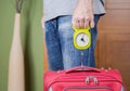 Man checking luggage weight with steelyard balance Royalty Free Stock Photo