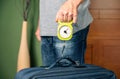 Man checking luggage weight with steelyard balance Royalty Free Stock Photo