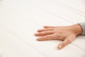 Man checking mattress firmness, closeup. Space for text